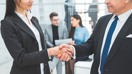 businessman and businesswoman discussing a business document