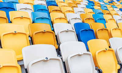 Fototapeta na wymiar Empty stadium seats with the raised lids.