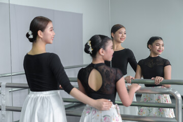 Female ballet dancers rehearse in ballet classes, they practice dancing, they are professional theater actors.