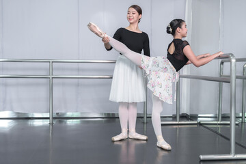 Female ballet dancers rehearse in ballet classes, they practice dancing, they are professional theater actors.
