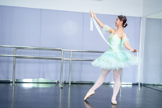 Female ballet dancers rehearse in ballet classes, they practice dancing, they are professional theater actors.
