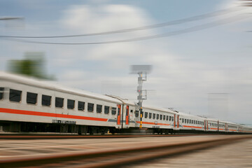 Motion blur of passanger train moving on railroad