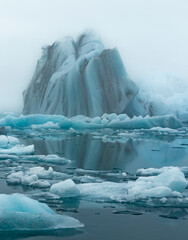 Large blue icebergs float in the Jokulsarlon Glacier Lagoon in southeast Iceland