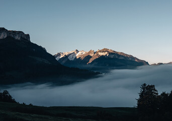 Morning fog in the swiss alps. The Alpstein region with the highest mountain Säntis is famous for its beautiful hiking trails. 
