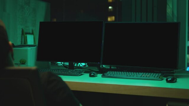 Two monitors with black empty screen in dark modern room. Concept of monitoring , trading , analysing , edititing room and security systems . Screen place for tracking image or video