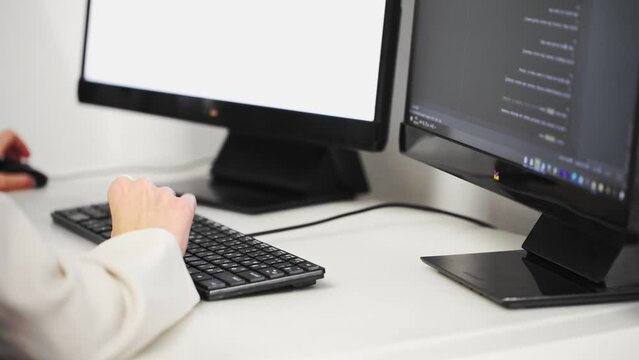 Scrolling the HTML web page code. Young female programmer