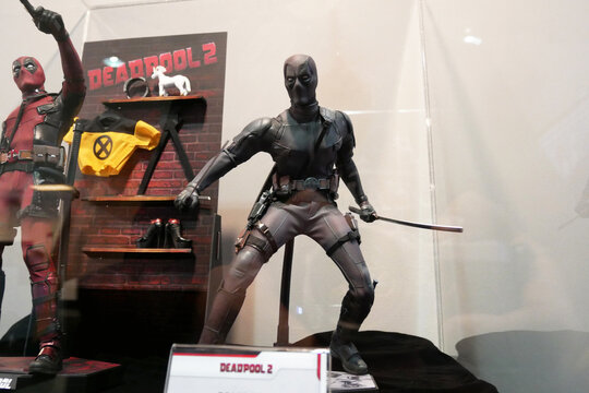 PENANG, MALAYSIA -MARCH 23, 2022: Fiction character of Deadpool from Marvel movies and comic. Deadpool action figure toys displayed by collector for the public. 
