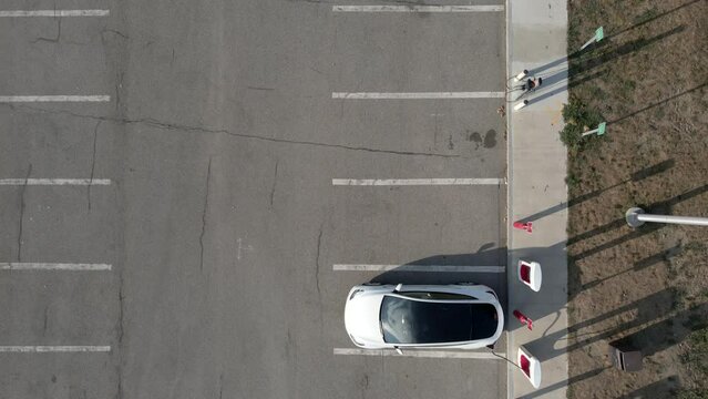 Footage of electric car on EV charging station