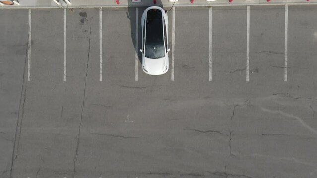 Footage of electric car on EV charging station