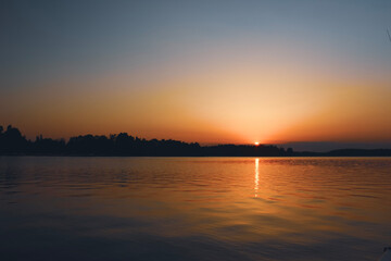 Fototapeta premium sunset over the river