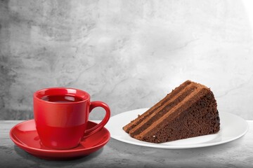 Tasty sweet dessert and a cup of drink on table