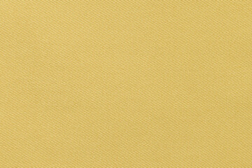 Texture of natural ocher color twill fabric close-up. the background for your mockup