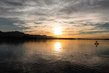 Fototapeta na wymiar sup in sunset over the lake