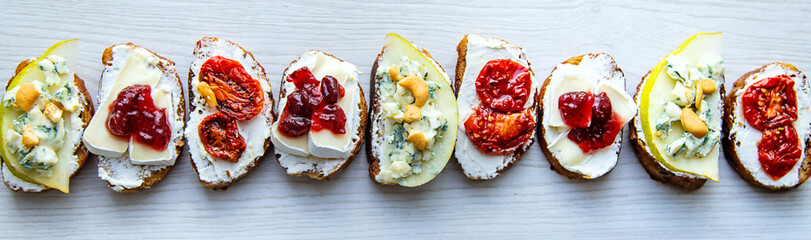 Bruschetti with cheese on a plate. Selective focus.