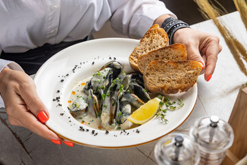 Cream of Mussel Soup on the table in the restaurant
