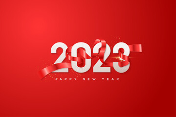 2023 happy new year with red ribbon wrapped around the numbers.