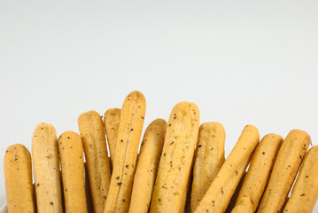 A pile of delicious seaweed breadsticks isolated on white background, close up.