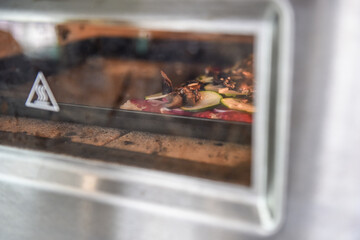 Pizza im Ofen eines take aways