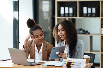 African American Businesswoman Using Laptop In Modern Office.