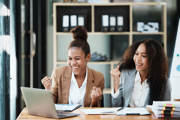 Two women have a meeting and receive good news in the team.