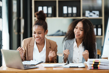 Two women have a meeting and receive good news in the team.