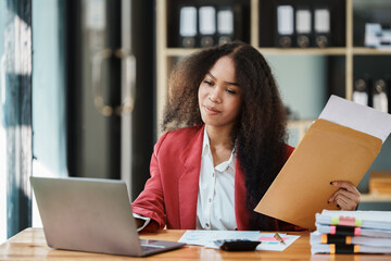 Friendly business woman using smartphone and talk with smile on her face. Happy female phones at the working . Attractive ethnic model with long black hair wearing in formal