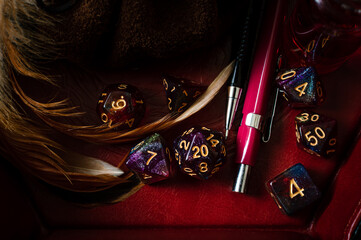 Cose-up Image of a purple D20 in a dice tray