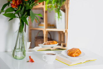Morning breakfast with coffee and croissant. Still life concept.