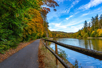 Road along the Vltava river in the autumn season.