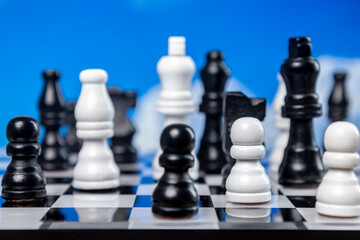 Chess with passing clouds behind