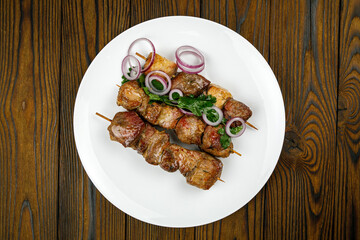 baked meat, barbecue on a wooden table
