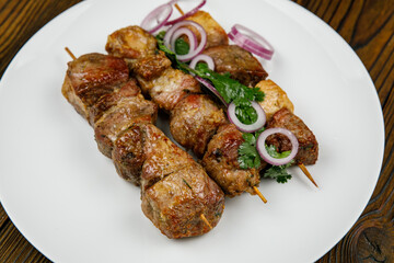 baked meat, barbecue on a wooden table
