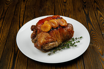 baked meat, pork on a wooden table
