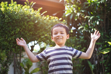 Happy cute child having fun in the garden.
