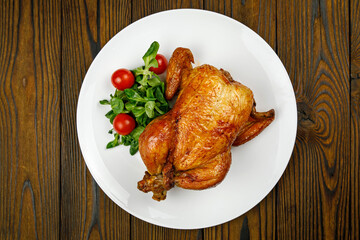 baked meat, grilled chicken on a wooden table
