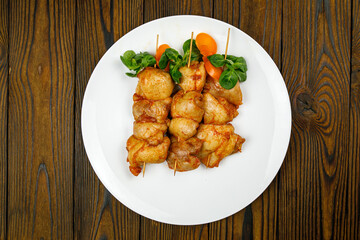 baked meat, barbecue on a wooden table
