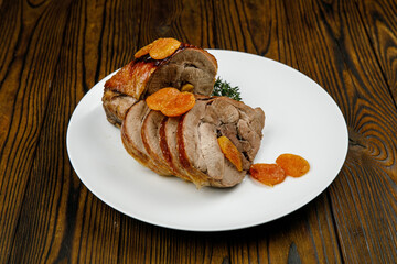 baked meat, pork on a wooden table
