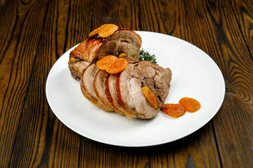 baked meat, pork on a wooden table
