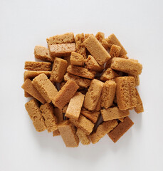 Croutons on white background, top view. Copy space, closeup, top view, flat lay.  