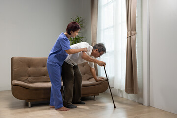 Caregiver takecare older man that having Sarcopenia or muscle loss. Sarcopenia is a degenerative...