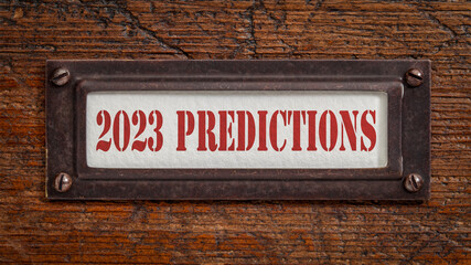 2023 predictions - a label on grunge wooden file cabinet. Expectation and speculation for the incoming year.