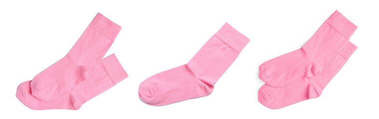 Set with pairs of pink socks on white background, top view. Banner design