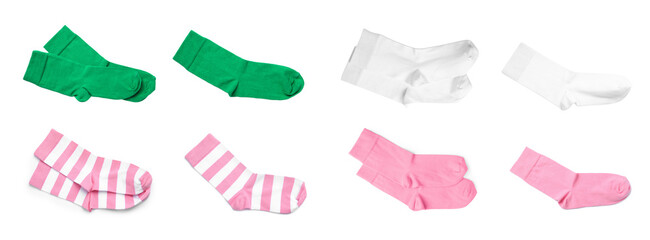 Set with pairs of different color socks on white background, top view. Banner design