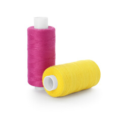 Different colorful sewing threads on white background