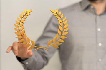 winner honer prize in hand