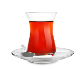 Glass of traditional Turkish tea with spoon isolated on white