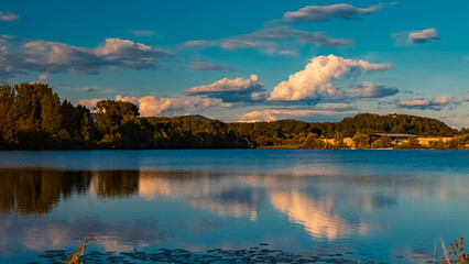 Beautiful summer view with reflections at a pond near Plattling, Isar, Bavaria, Germany