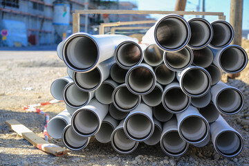 On site: Stockpiled plastic tubes or pipes for utility lines used in the subterranean groundwork