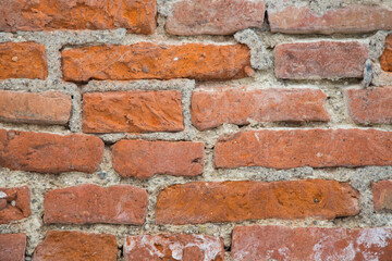 Obraz premium Natural stone texture for garden design, landscaping or environmentally sustainable engineering- wall or brickwork with old red bricks filled or jointed with stones and cement
