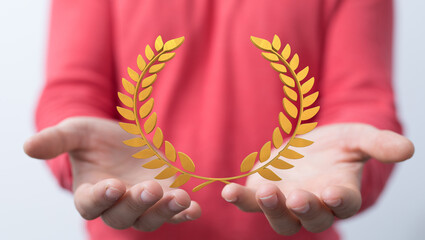 winner honer prize in hand